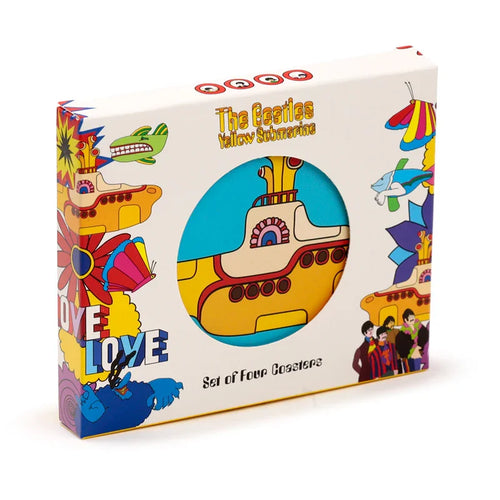 Angled view of a white box for a set of cork novelty coasters, featuring colourful psychedelic artwork including 'The Beatles Yellow Submarine' text and a circular cut-out revealing one yellow submarine coaster on a blue background.