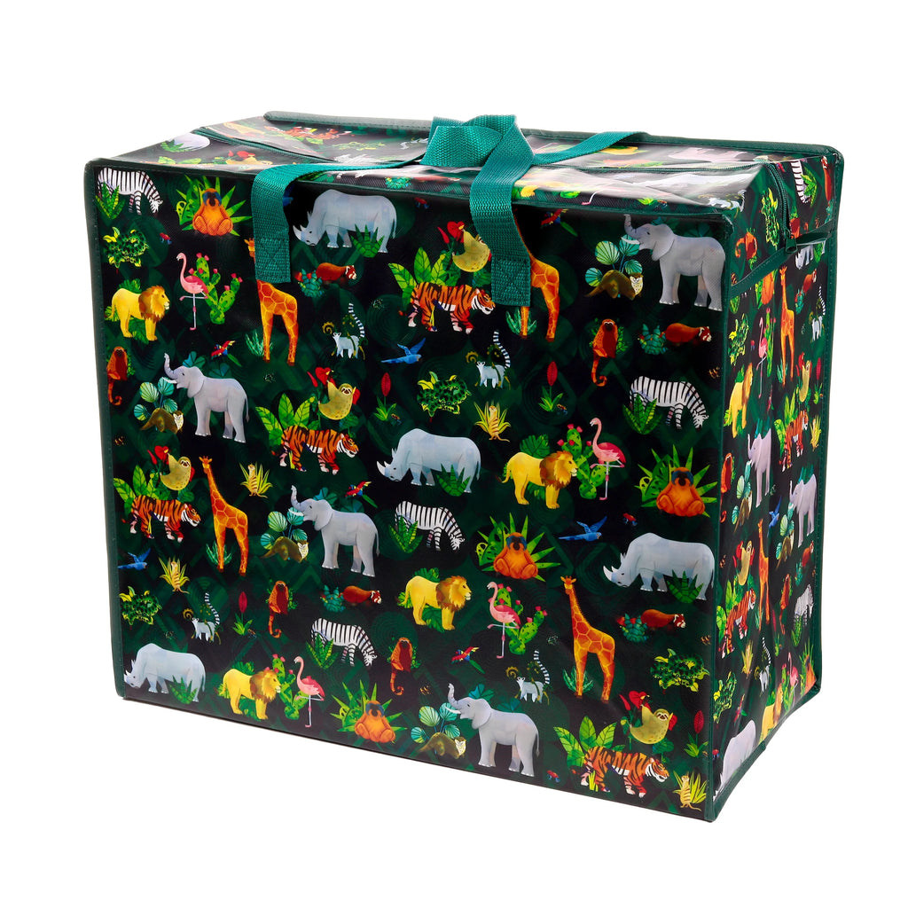 Angled view of a dark green laundry and storage bag featuring a colourful Animal Kingdom pattern with illustrations of elephants, giraffes, zebras, lions, tigers, rhinos, and flamingos amidst jungle foliage. The bag has green webbing handles tied at the top and a zip closure.