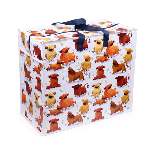 Angled view of a white laundry and storage bag featuring a pattern of brown and orange Hairy Coos Highland cattle, with dark blue fabric handles.