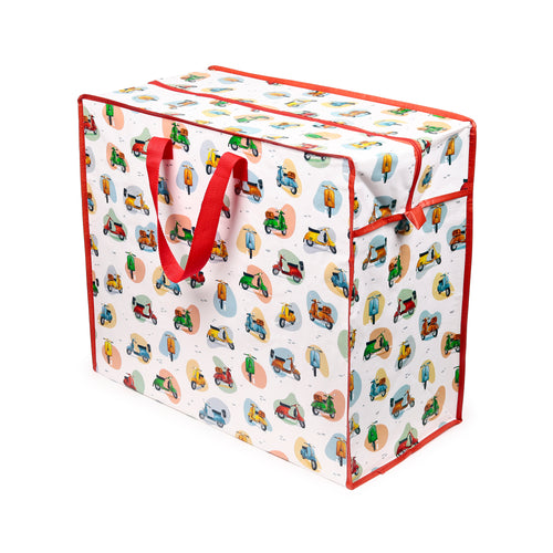 Angled view of a white laundry and storage bag featuring a colourful scooter pattern, with red zip closure and red fabric handles.