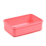 Angled view of an open, rectangular, coral-pink plastic lunch box container.