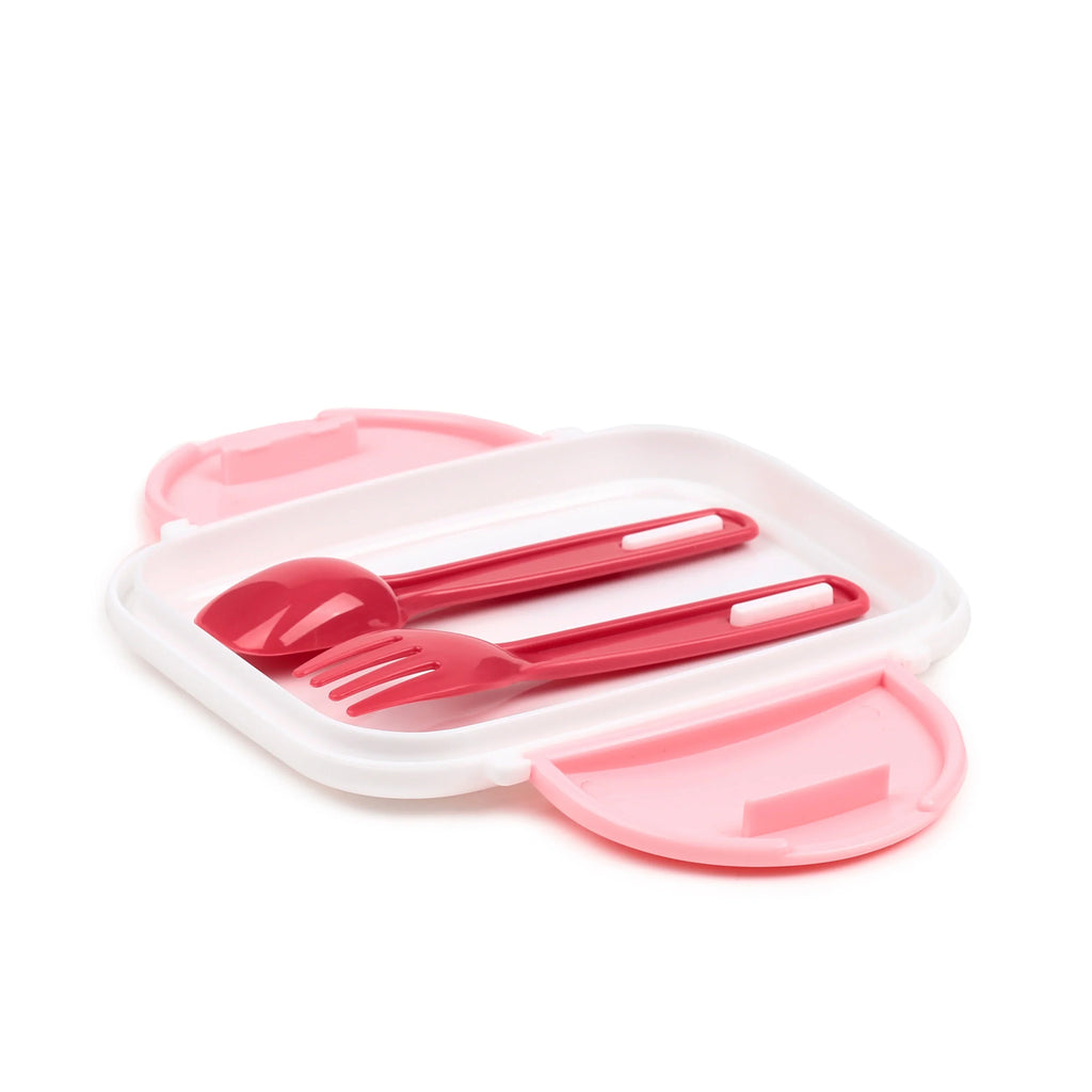 Angled view of an open bento clip lock lunch box, showing a white compartment, a light pink lid with visible clips, and dark pink plastic cutlery (spoon and fork) nestled inside.