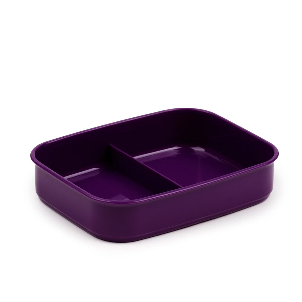 Angled view of a purple bento lunch box base with two compartments.