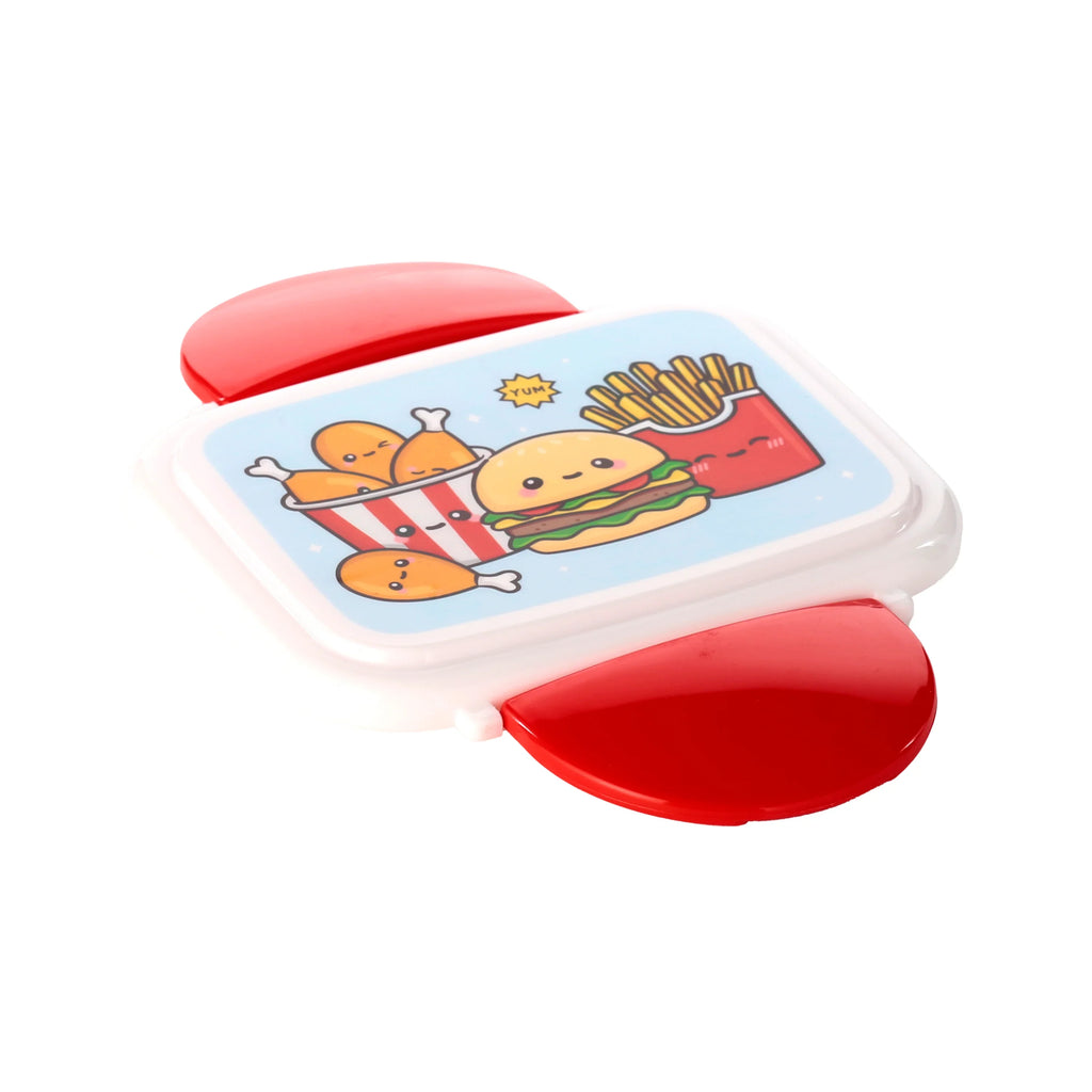 Angled overhead view of a white bento lunch box with red clip locks, featuring a cartoon design of smiling fried chicken, a hamburger, and french fries on the lid.