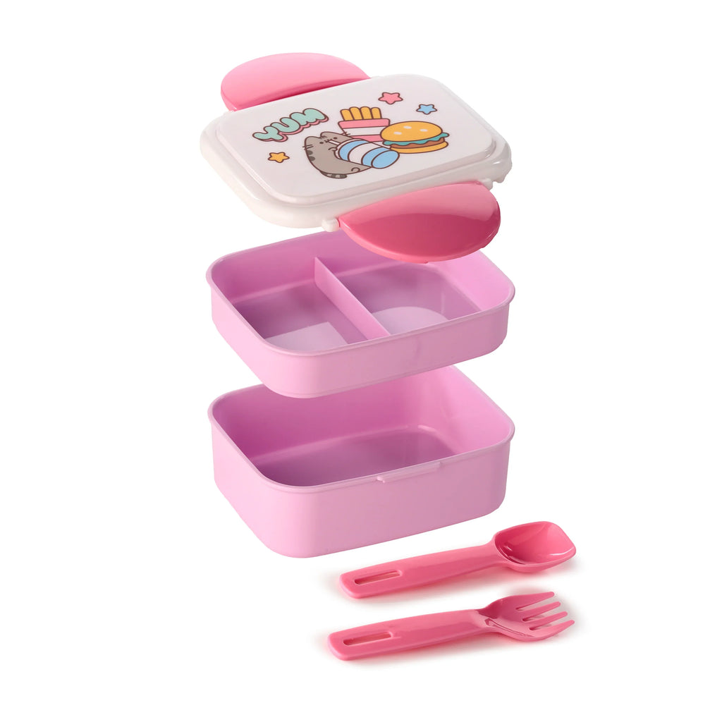 Pink and white bento lunch box with stackable components displayed, including a lid with a colourful cat character and fast food illustration, two containers (one with a divider), and matching pink spoon and fork.