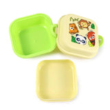 Overhead view of a disassembled Bento clip lock snack lunch box, featuring a lime green base, a light yellow lid with a cartoon wild animal design (tiger, monkey, panda, red panda), and a separate yellow inner tray.