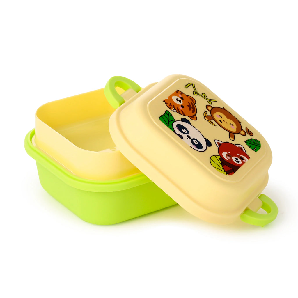 Angled view of a green bento clip lock snack lunch box with a pale yellow lid. The lid, decorated with colourful illustrations of a tiger, panda, monkey, and red panda, is partially open, revealing a light yellow inner tray.