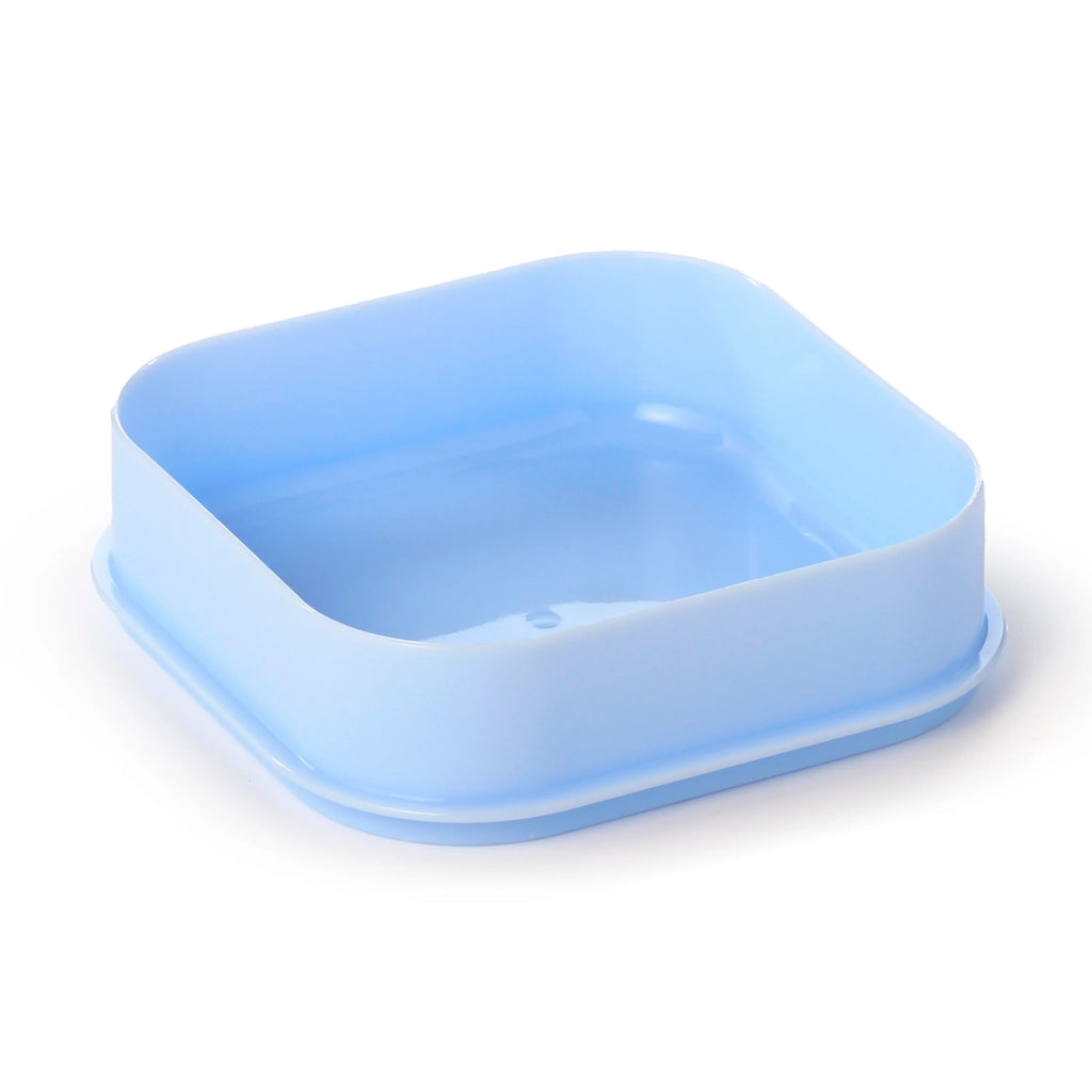 Angled view of a light blue plastic bento snack lunch box lid with rounded corners and a rim.