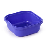 Angled view of an empty, royal blue plastic bento lunch box base.