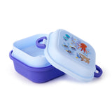 Angled view of a partially open bento clip lock lunch box, featuring a dark purple base and a light blue lid with a colourful marine life design including an octopus, jellyfish, and fish.