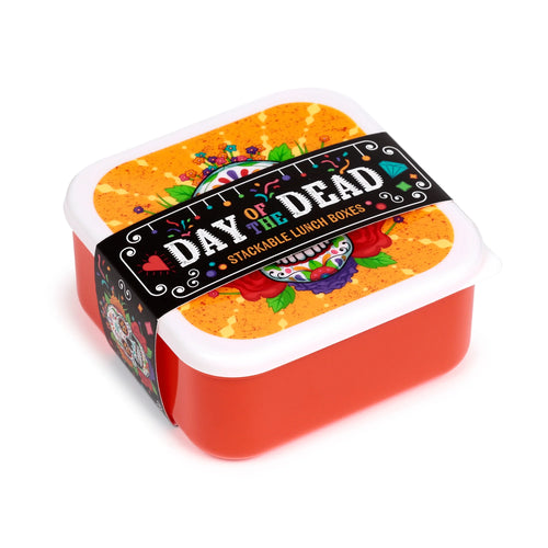 Elevated angled view of a set of red and white stackable Day of the Dead lunch boxes, featuring a colourful sugar skull and floral design on the lid and packaging band.