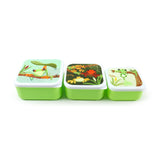 Angled view of a set of three green lunch boxes of varying sizes, with white lids each featuring a different tropical tree frog design, displayed in a row on a white background.