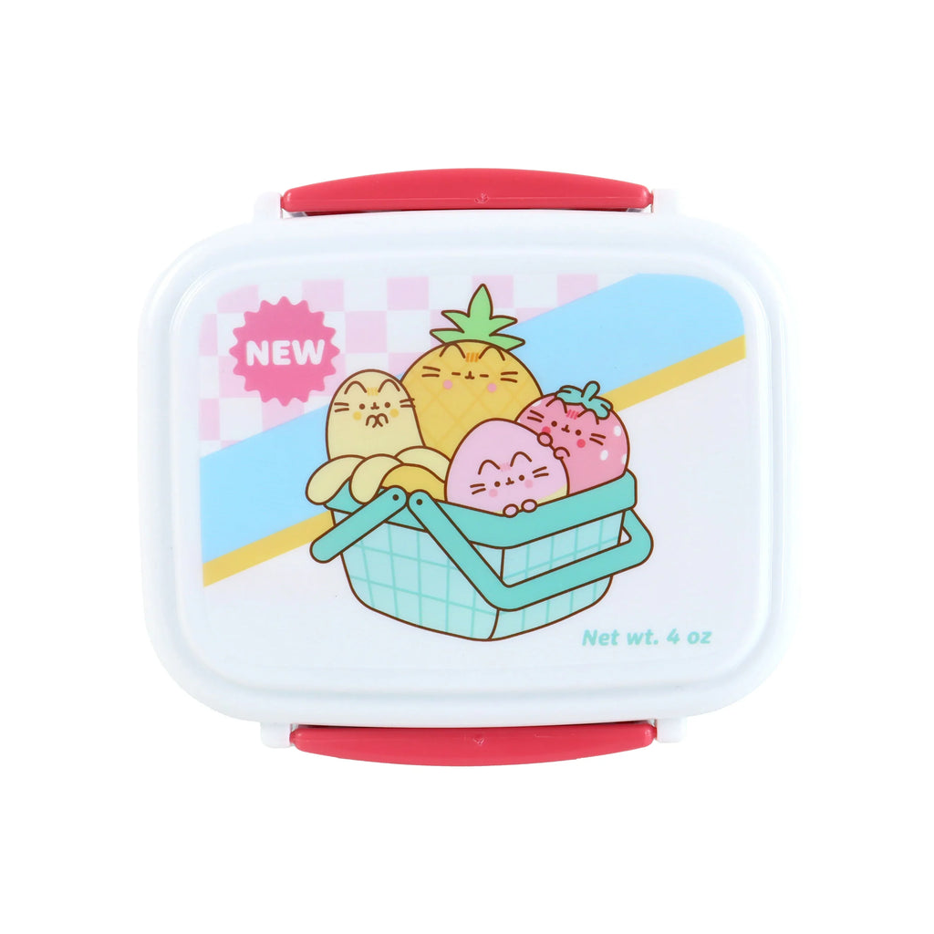 Top-down view of a white clip lock lunch box with red clips, featuring a colourful illustration of Pusheen the Cat fruit characters (banana, pineapple, strawberry) in a light blue picnic basket, against a pink chequered and striped background.