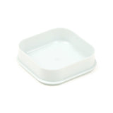 Angled view of a pale green-white, square base for a bento snack lunch box.