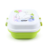 Angled view of a white and lime green bento snack lunch box. The white lid features a Moomin character outline amongst colourful foliage, and lime green clip locks are visible on the sides.