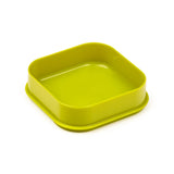 Lime green plastic square lunch box base with rounded corners, angled view.