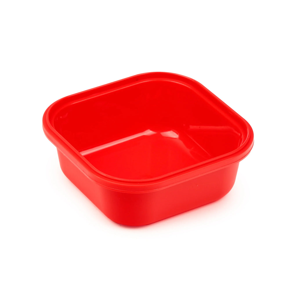 Angled view of a red square plastic snack lunch box base, showing its interior.