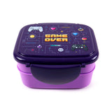 Angled view of a purple bento clip lock lunch box, featuring a dark purple lid with a pixelated 'Game Over' gaming design, including controllers, a skull, and coins, atop a lighter purple base.
