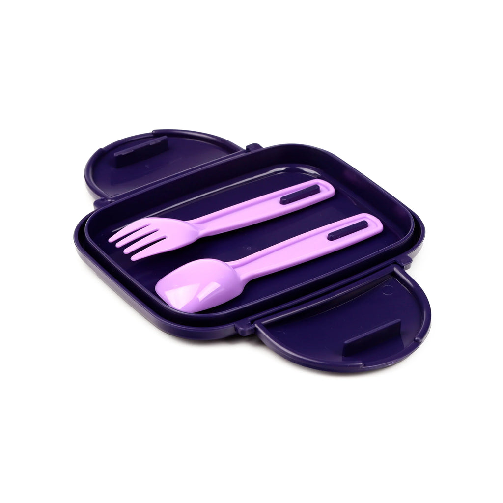 Angled view of an open plum-coloured bento clip lock lunch box with a light purple fork and spoon inside.