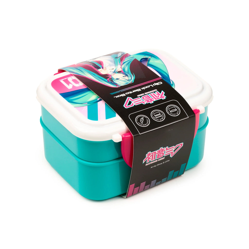 Angled view of a turquoise and white two-tiered bento lunch box with pink clip locks. It features a decorative band with the Hatsune Miku anime character and 'Clip Lock Bento Box' text, along with Japanese writing.
