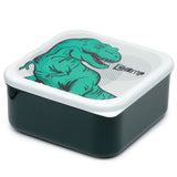 Angled overhead view of a dark green square lunch box with a white lid, featuring a green T-Rex dinosaur graphic and 'CHOMP' text.
