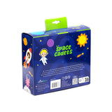 Angled view of dark blue packaging for a lunch box and water bottle set, featuring space-themed illustrations of planets, stars, an astronaut, a rocket, and an alien, with 'space cadets' text in green and a light green hanging tab at the top.