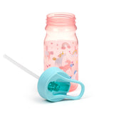 Angled view of a pink children's water bottle, patterned with unicorns, rainbows, hearts, and stars. Its light blue straw lid is detached and rests beside it, on a white background.