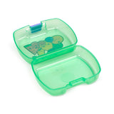 Angled overhead view of an open translucent green lunch box, revealing a colourful Foodiemals graphic inside the lid.