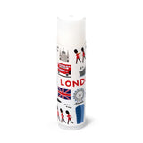 White lip balm stick standing upright, featuring colourful illustrations of London landmarks including a red double-decker bus, Union Jack flag, London Eye, and Royal Guards.