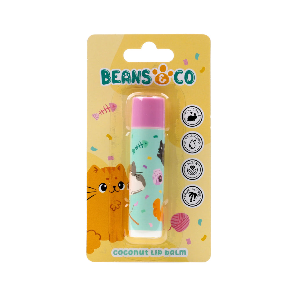 Front view of a stick lip balm in cat-themed retail packaging. The lip balm has a pink cap and a light blue body with a pattern of cartoon cats, fishbones, and paw prints. The yellow cardboard backing displays an orange cat graphic, 'BEANS & CO' branding, 'coconut Lip balm' text, and circular icons indicating cruelty-free, moisturising, vegan, and palm oil free features.
