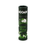 Angled view of a dark green cylindrical paper stick lip balm. It features white 'MOOMIN' text and lighter green illustrations of Moomin characters amidst a garden scene with plants and butterflies, alongside the text 'GARDEN LIFE IN MOOMIN VALLEY'.