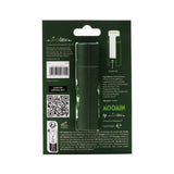 Back view of a dark green paper stick lip balm in its recyclable card packaging, showing a barcode, ingredient list, Moomin branding, push-up instructions, and subtle garden-themed illustrations on the lip balm through a cut-out.
