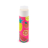 Paper stick lip balm standing upright, with exposed translucent balm. Its bright pink casing features colourful summer fruit illustrations, including pineapple, lemon, peach, orange, and watermelon, on a white background.