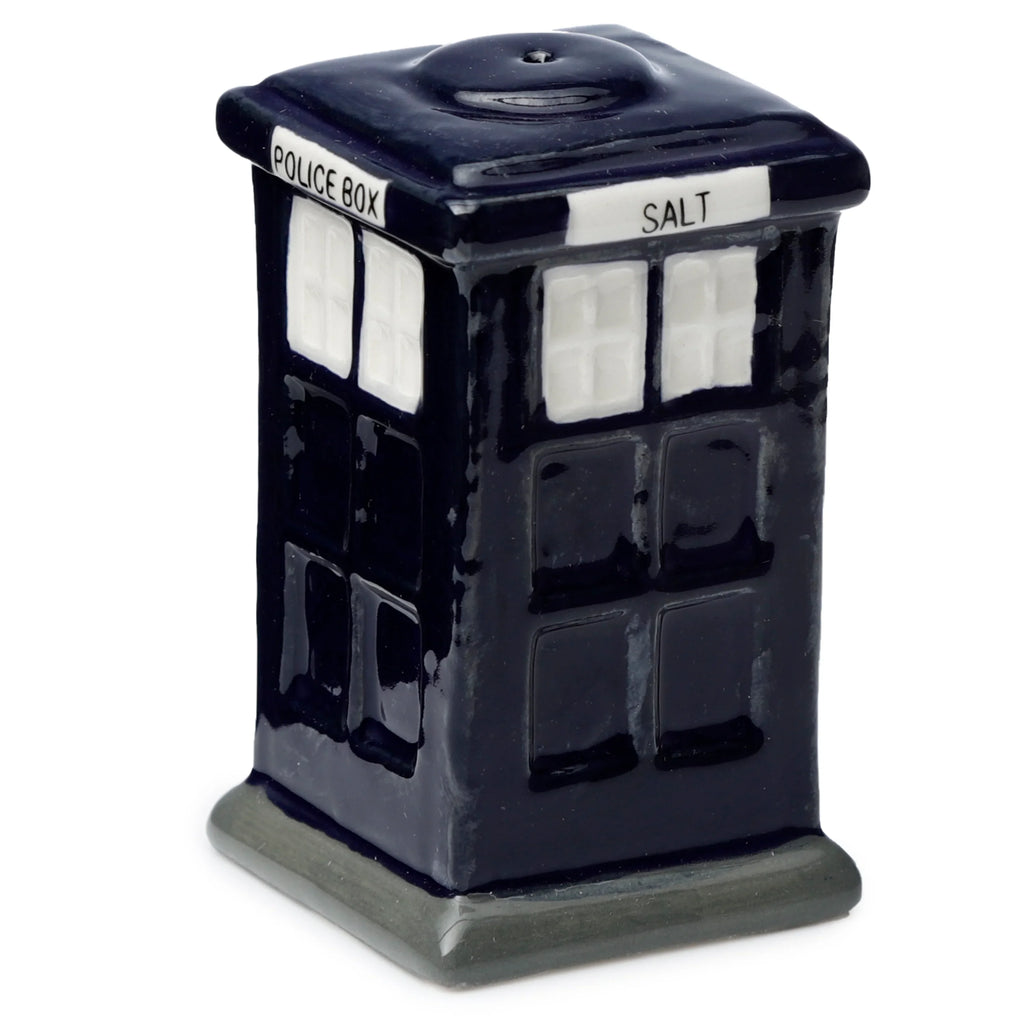 Angled view of a dark blue ceramic salt shaker shaped like a police box, showcasing its white window details, the 'POLICE BOX' text on its main face, and the 'SALT' text on its visible side, with a dispensing hole on top.