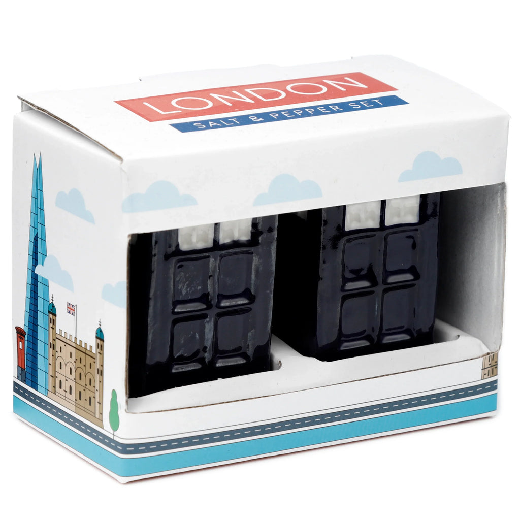 Angled front view of a ceramic Police Box London Icons salt and pepper set. Two dark blue police box shaped shakers are shown inside their open white presentation box, which features 'LONDON SALT & PEPPER SET' text and illustrations of London landmarks like The Shard, Tower of London, and a red post box.