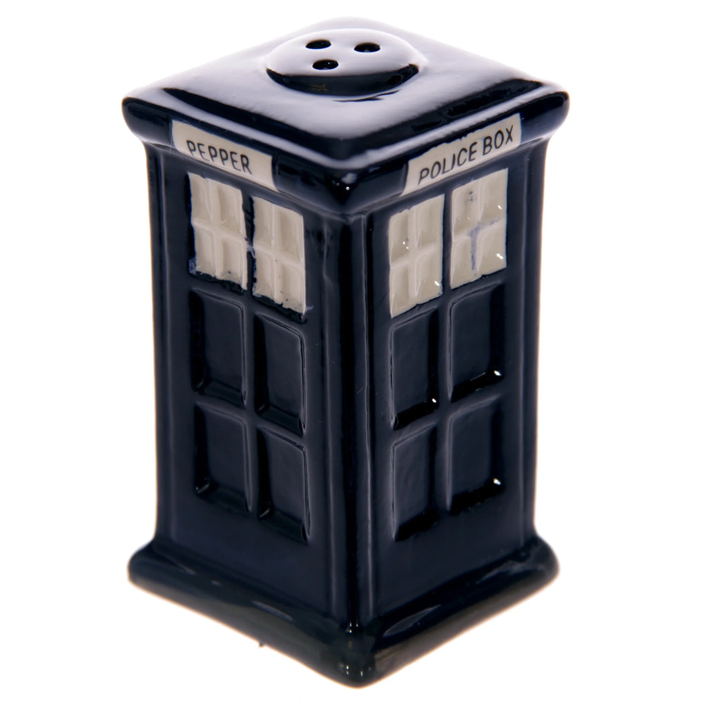 Angled view of a dark blue ceramic pepper shaker shaped like a police box, featuring white window details, 'PEPPER' text, 'POLICE BOX' text, and three holes on its top.