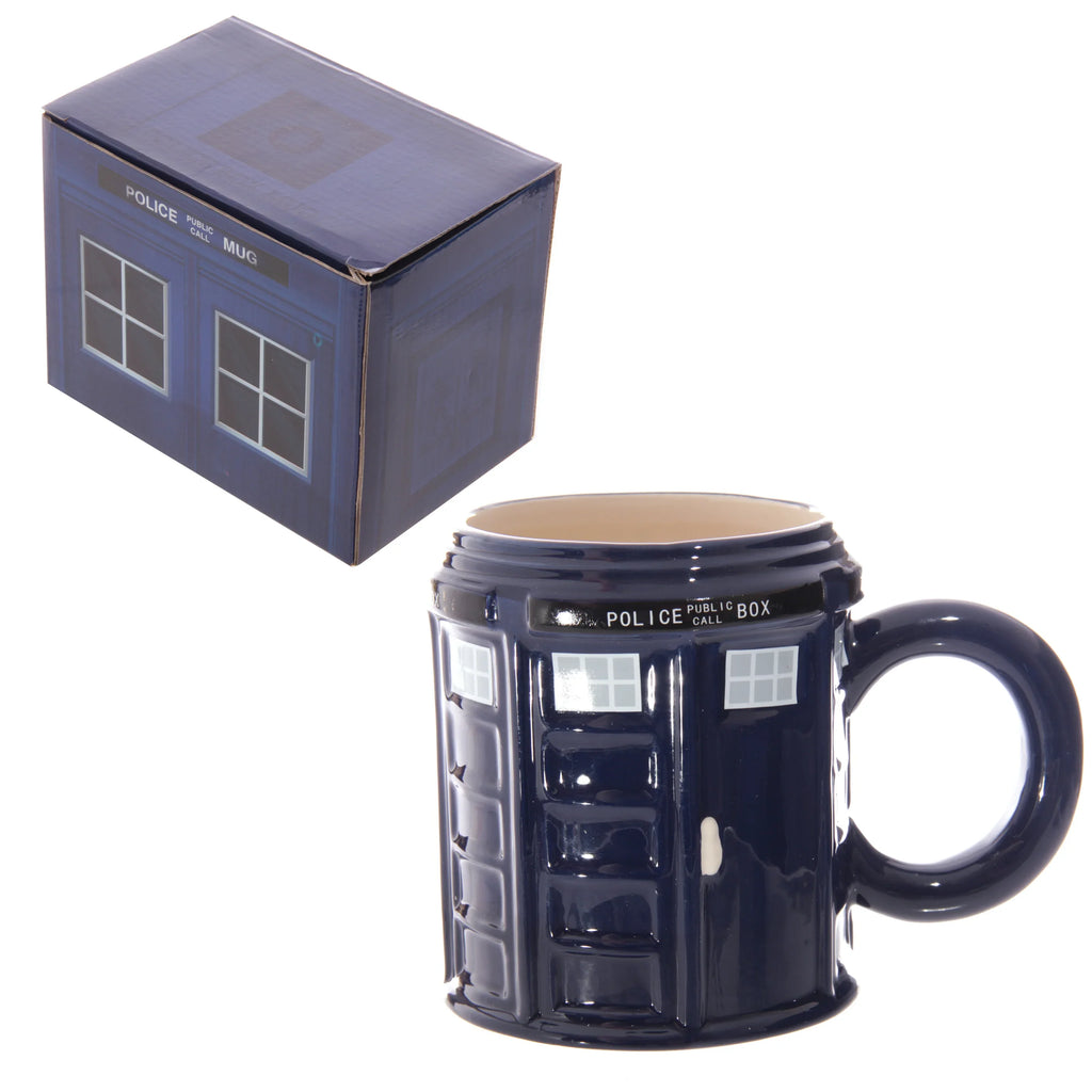 Angled view of a blue ceramic novelty police box mug, showing its white window details, 'POLICE PUBLIC CALL BOX' text, and handle. The matching blue packaging box, also with police box design and 'POLICE PUBLIC CALL MUG' text, is visible from an overhead angle.