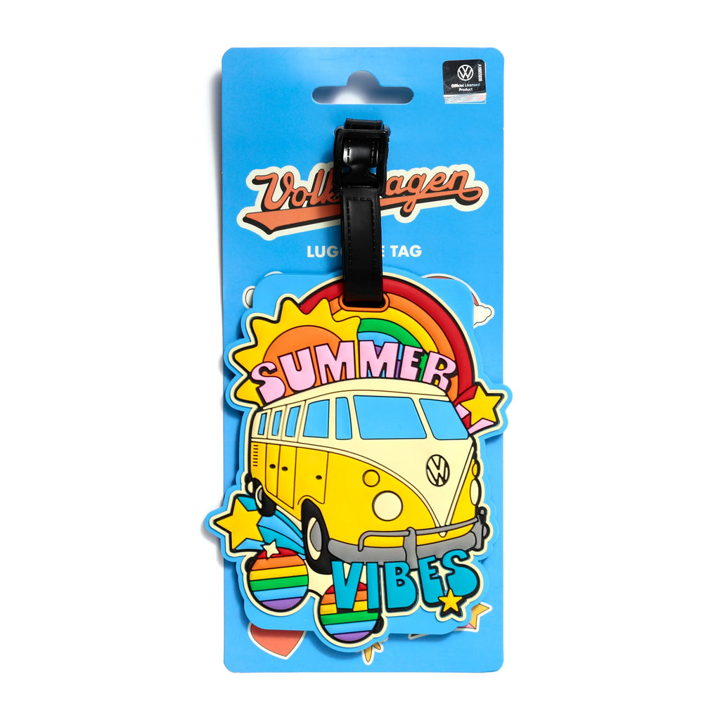 Front view of a colourful PVC luggage tag on light blue packaging, depicting a yellow Volkswagen VW T1 Camper Bus, a rainbow, sun, and the words 'SUMMER VIBES'.