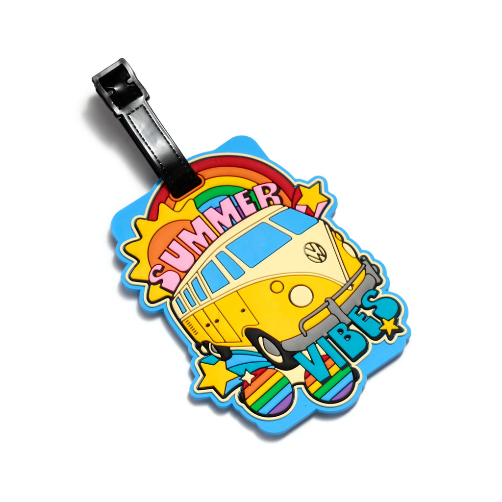 Colourful PVC luggage tag featuring a yellow Volkswagen T1 Camper Bus illustration, 'SUMMER VIBES' text, a rainbow, and stars on a light blue base, with a black attachment strap, shown from an angled view.