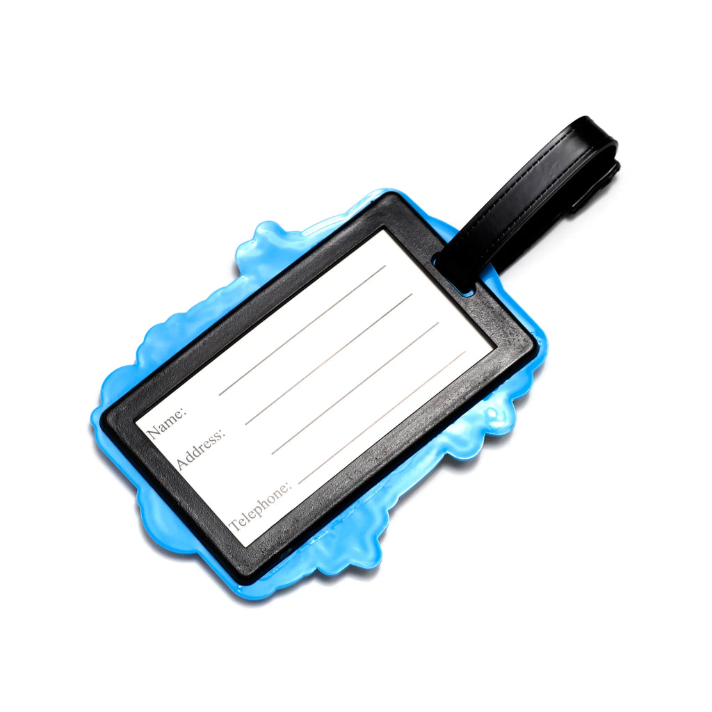 Reverse of a black luggage tag with a light blue wavy border, displaying a white insert for name, address, and telephone details, and a black strap.
