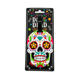 Front view of a colourful PVC Day of the Dead luggage tag, depicting a vibrantly patterned sugar skull design, presented on its black retail backing card.