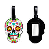 PVC luggage tag, front and reverse views, depicting a vibrant, multi-coloured Day of the Dead sugar skull design on the front and a plain black reverse with an address slot.