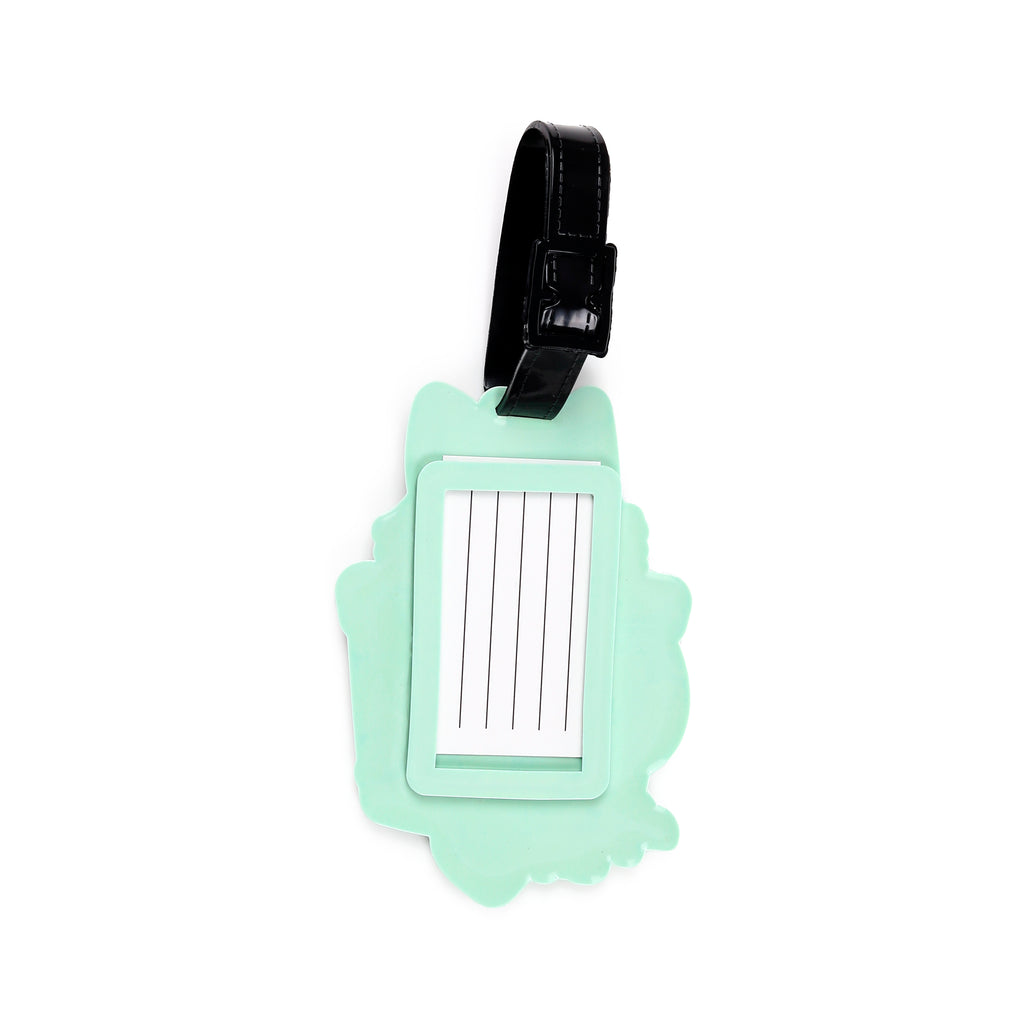 Angled view of a mint green cat-shaped PVC luggage tag, featuring a black buckled strap and a white information card with lines for writing details.