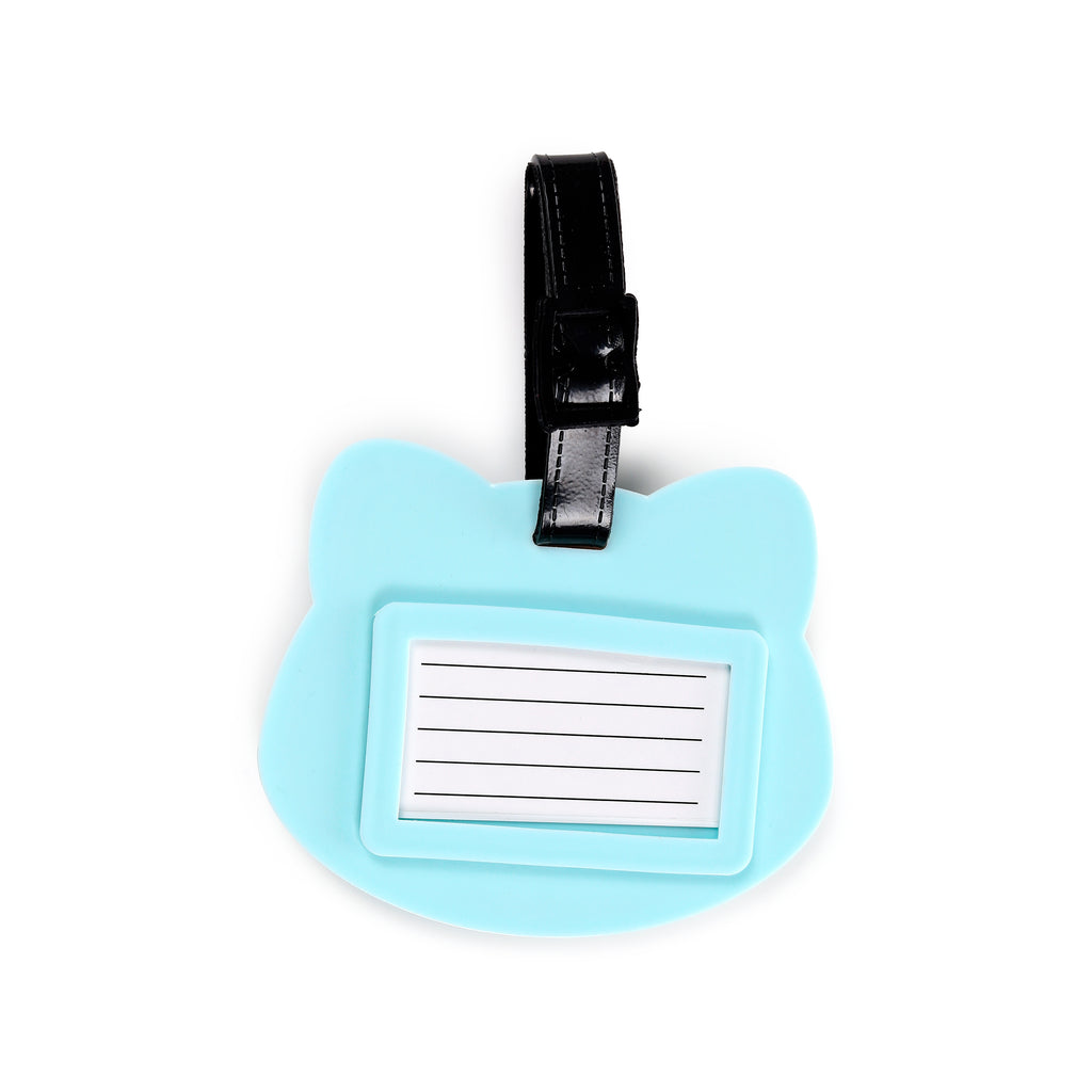 Overhead view of a light blue PVC luggage tag, shaped like a Shiba Inu head, featuring a black buckle strap and a rectangular address card slot with blank lines.