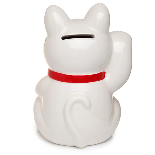 Back view of a white ceramic Maneki Neko lucky cat money box, with a red collar, showing the coin slot on its head, its curled tail, and one raised paw.