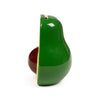 Side view of a glossy green ceramic avocado money box, split to show a red-brown pit, with a coin slot visible at the top.