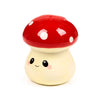 Front view of a cute ceramic mushroom money box. It features a glossy red cap with white spots, and a cream-coloured stem with a smiling face, black eyes, and pink blushes.