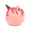 Pink ceramic unicorn money box, angled to show its glossy gold horn, sculpted pink mane, closed black eyelashes, and coin slot.