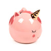 Angled front view of a glazed pink ceramic unicorn money box, featuring a golden horn, closed eye, and pink ears.