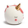 Angled view of a white ceramic unicorn money box, featuring a golden horn and pink details.